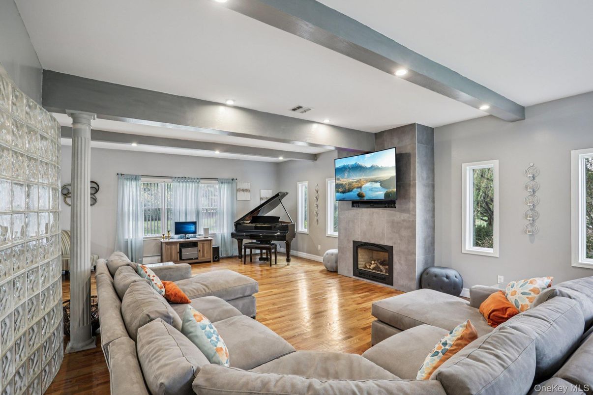 Fireplace, Interior, Living room, Piano, Recessed Lighting, Wood Texture Flooring