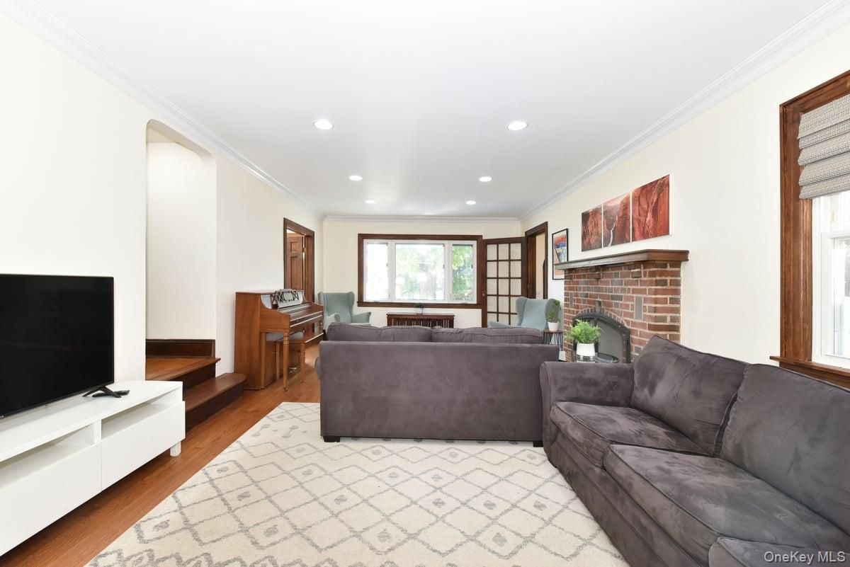 Fireplace, Interior, Living room, Piano, Recessed Lighting, Wood Texture Flooring