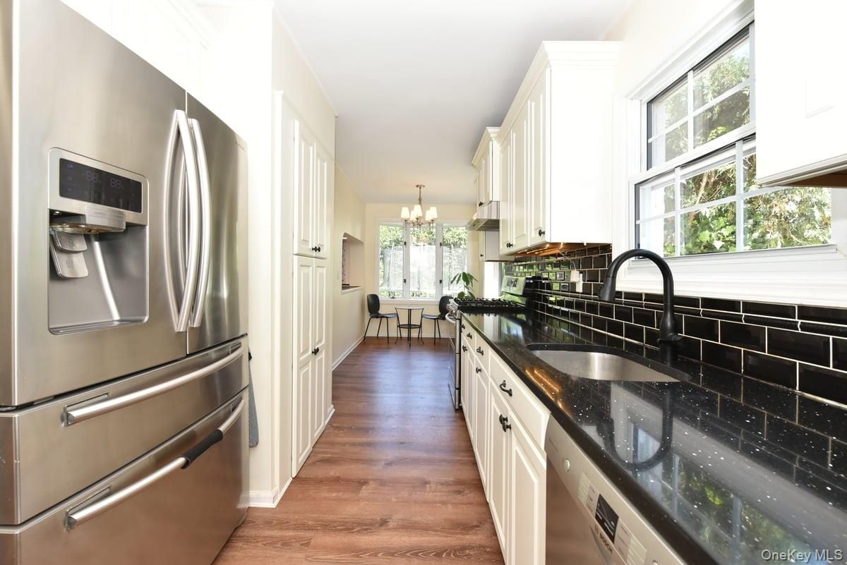 Chandelier, Dining room, Interior, Kitchen, Stainless Steel Appliances, Wood Texture Flooring