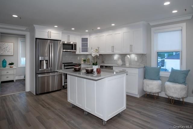 Interior, Kitchen, Marble Walls, Recessed Lighting, Stainless Steel Appliances, Wood Texture Flooring