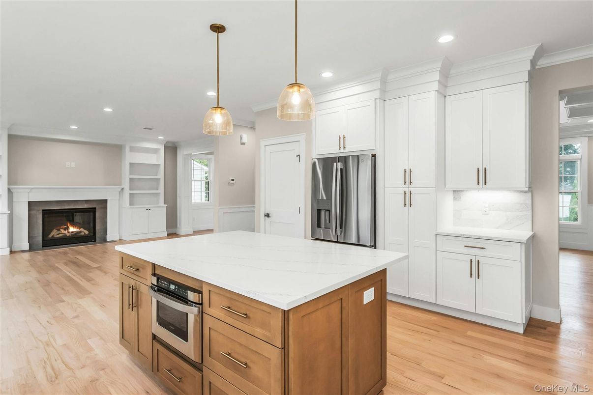 Fireplace, Interior, Kitchen, Pendant Lights, Recessed Lighting, Stainless Steel Appliances, Wood Texture Flooring