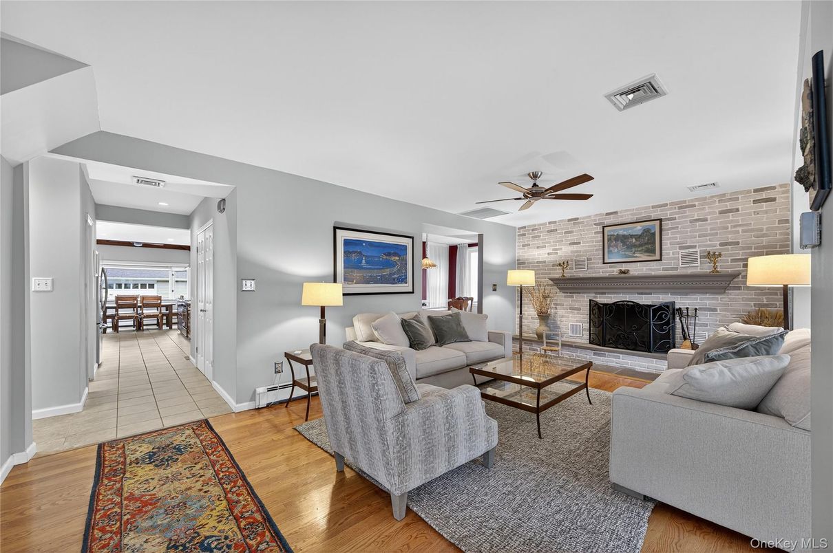 Fireplace, Interior, Living room, Recessed Lighting, Stone Walls, Wood Texture Flooring