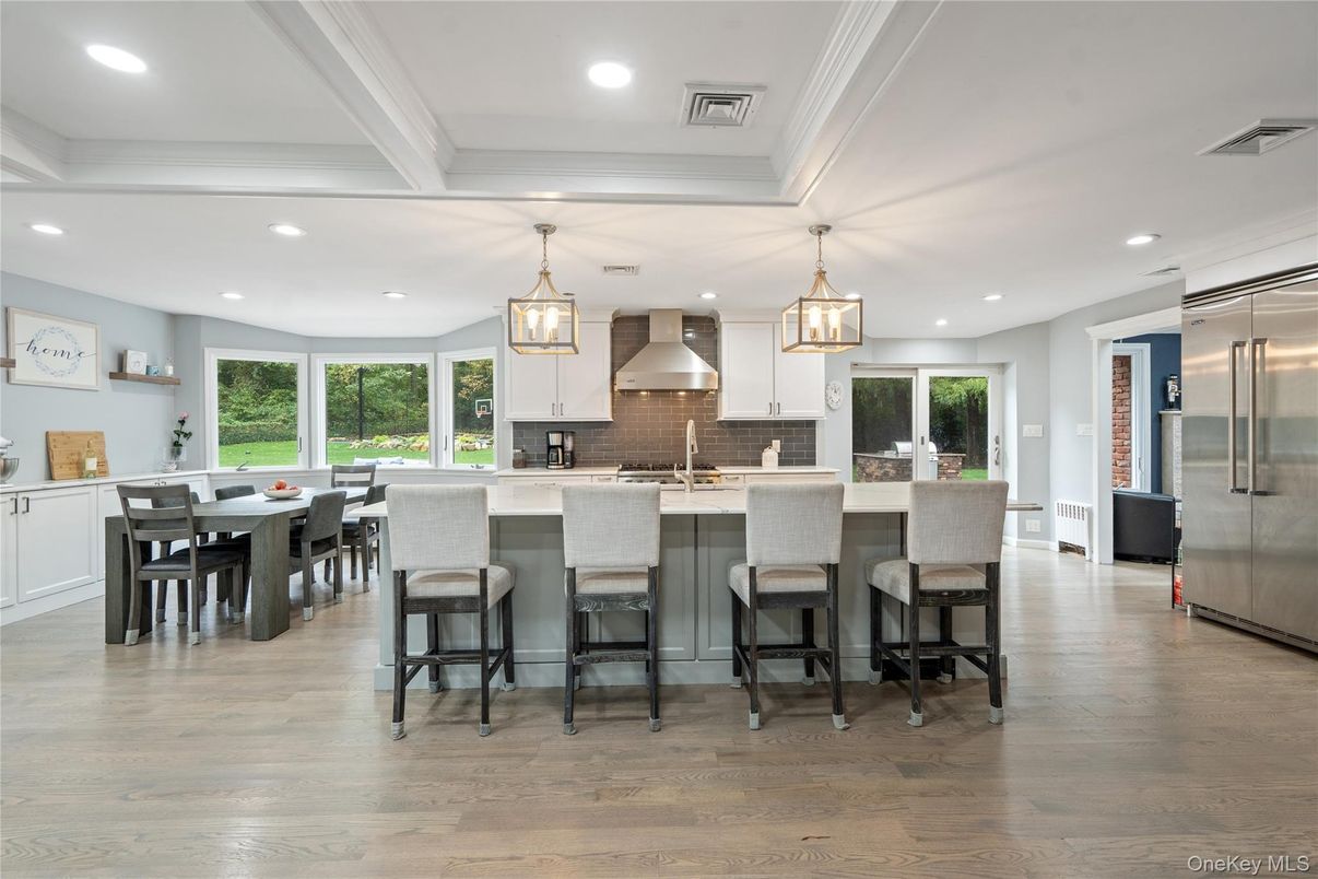 Dining room, Interior, Kitchen, Pendant Lights, Recessed Lighting, Stainless Steel Appliances, Wood Texture Flooring