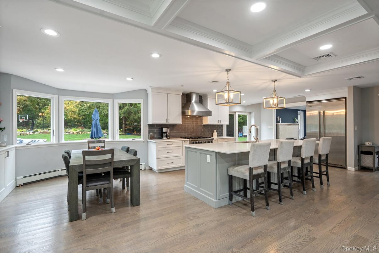 Dining room, Interior, Kitchen, Pendant Lights, Recessed Lighting, Stainless Steel Appliances, Wood Texture Flooring