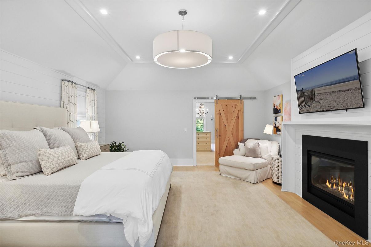 Bedroom, Fireplace, Interior, Pendant Lights, Recessed Lighting, Wood Texture Flooring
