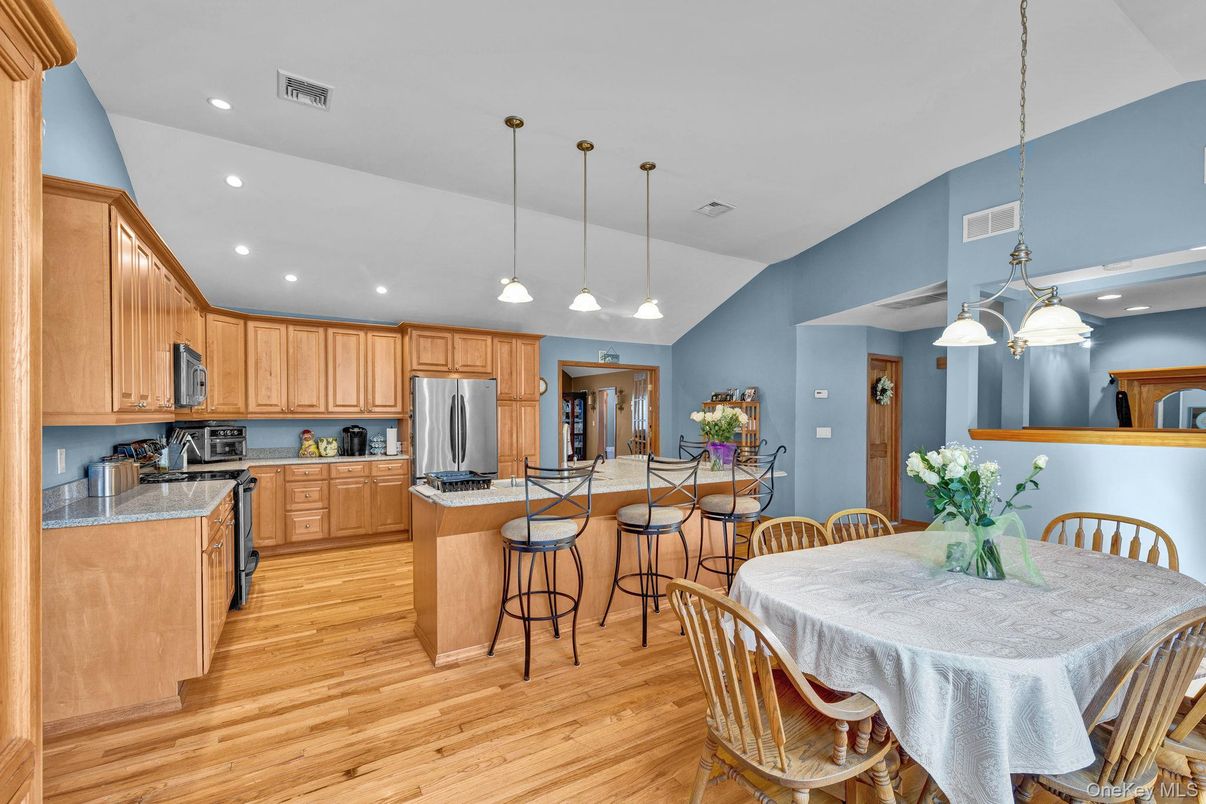 Dining room, Interior, Kitchen, Pendant Lights, Recessed Lighting, Stainless Steel Appliances, Wood Texture Flooring