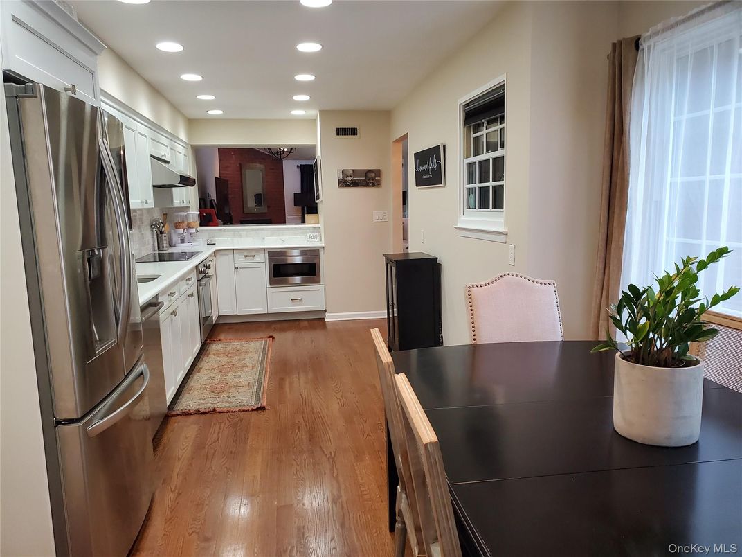 Dining room, Interior, Kitchen, Recessed Lighting, Stainless Steel Appliances, Wood Texture Flooring