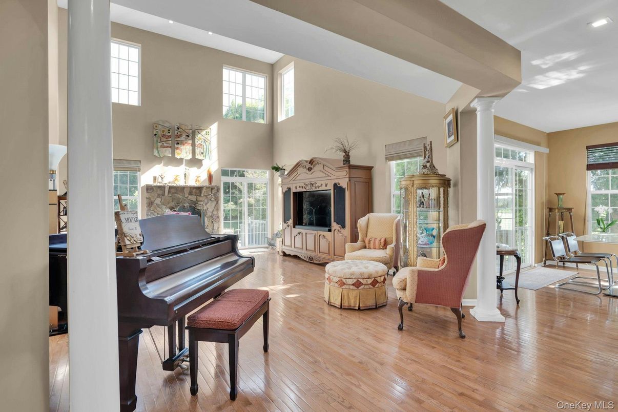 Fireplace, Interior, Living room, Piano, Recessed Lighting, Wood Texture Flooring