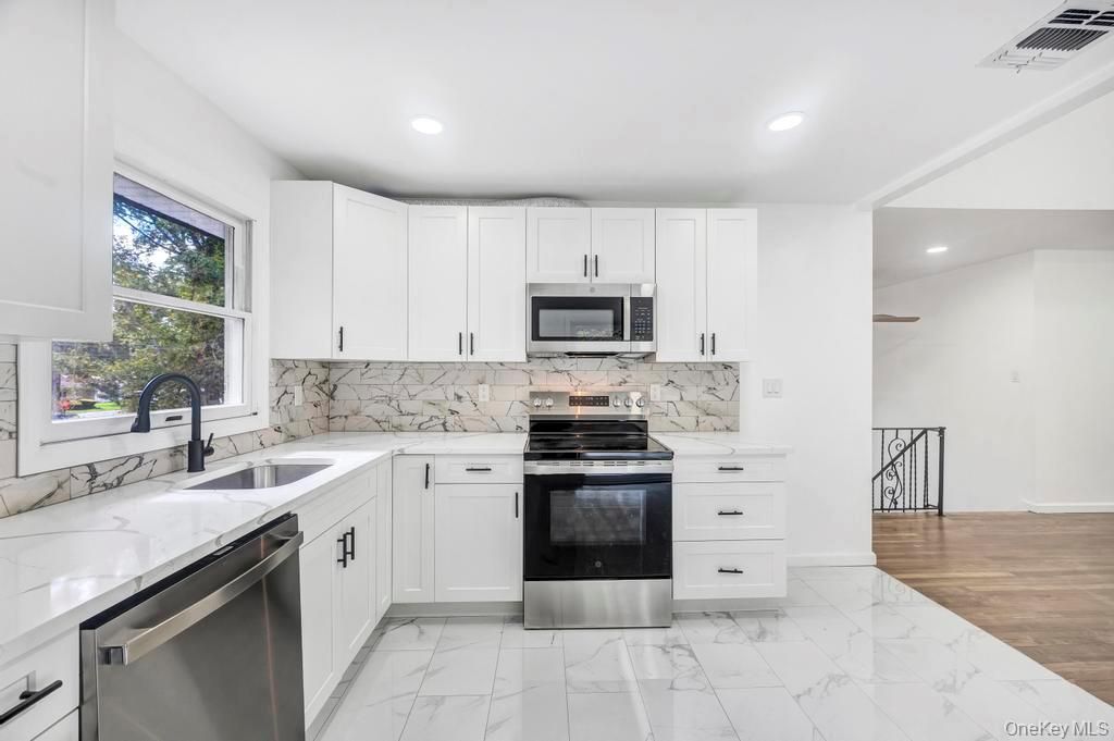Interior, Kitchen, Marble, Marble Walls, Recessed Lighting, Stainless Steel Appliances, Wood Texture Flooring