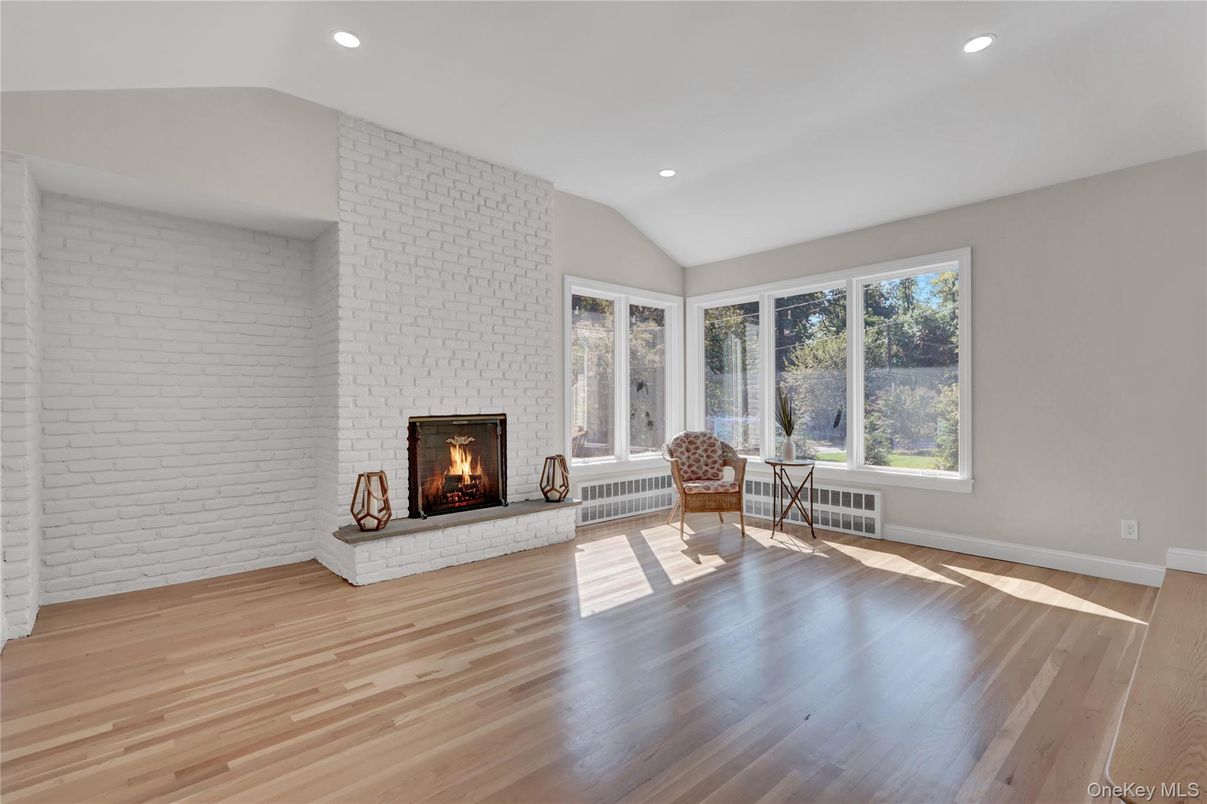 Empty room, Fireplace, Interior, Recessed Lighting, Stone Walls, Wood Texture Flooring