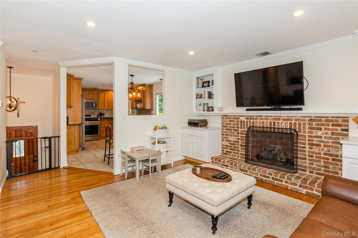 Chandelier, Dining room, Fireplace, Interior, Kitchen, Pendant Lights, Recessed Lighting, Stone Walls, Wood Texture Flooring