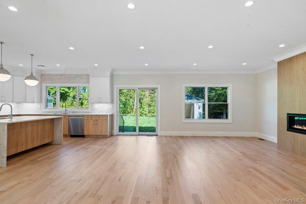 Empty room, Fireplace, Interior, Kitchen, Pendant Lights, Recessed Lighting, Wood Texture Flooring