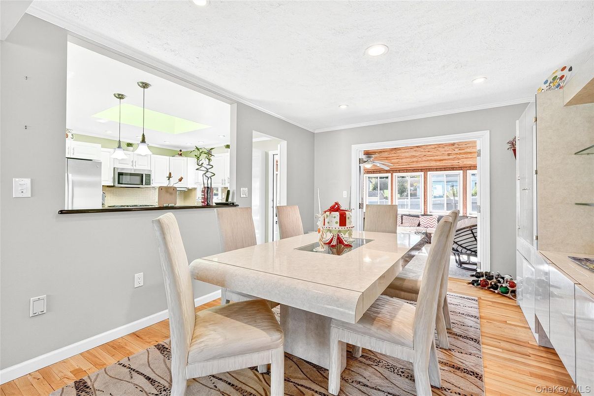 Dining room, Interior, Kitchen, Pendant Lights, Recessed Lighting, Stainless Steel Appliances, Wood Texture Flooring