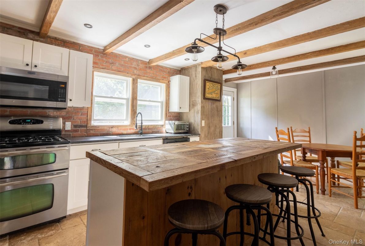 Interior, Kitchen, Pendant Lights, Recessed Lighting, Stainless Steel Appliances, Tile Countertops, Wooden Beams