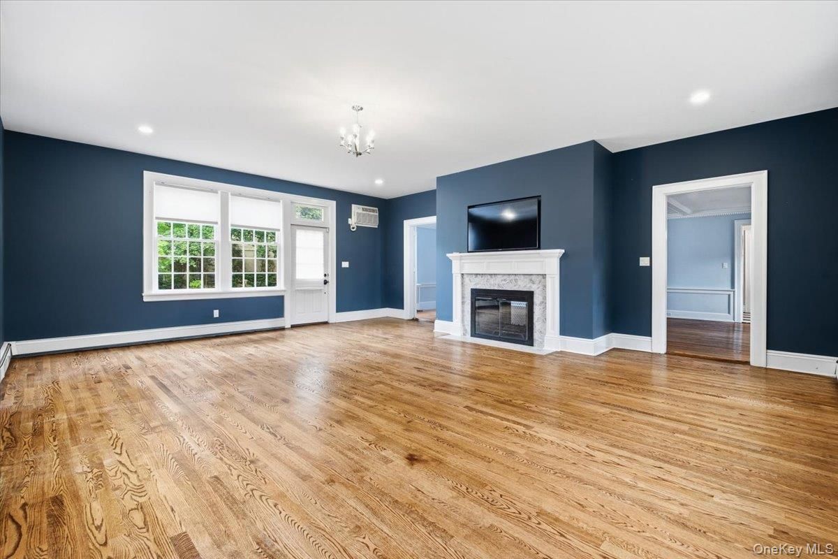 Chandelier, Empty room, Fireplace, Interior, Recessed Lighting, Wood Texture Flooring