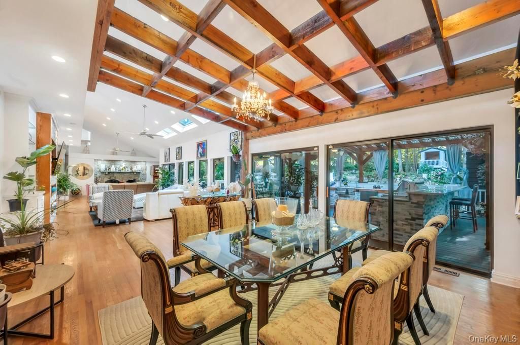 Chandelier, Dining room, Interior, Living room, Pendant Lights, Recessed Lighting, Wooden Beams, Wood Texture Flooring