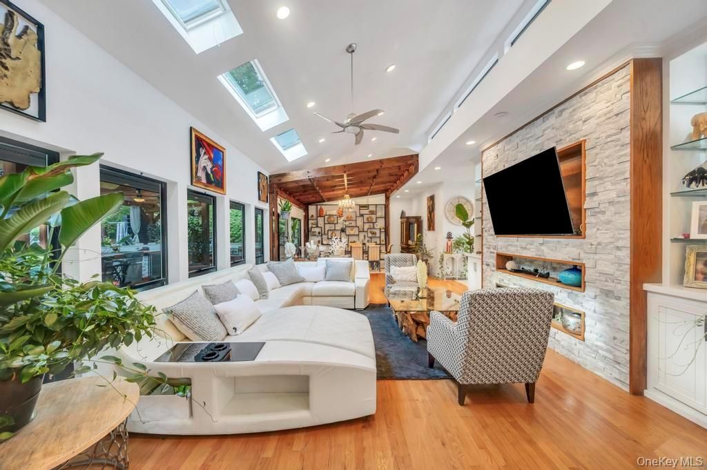 Fireplace, Interior, Living room, Recessed Lighting, Stone Walls, Wood Texture Flooring