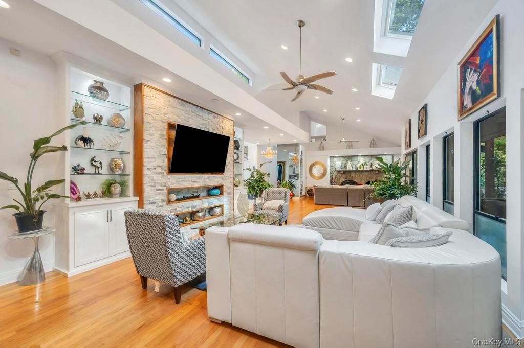 Fireplace, Interior, Living room, Recessed Lighting, Stone Walls, Wood Texture Flooring