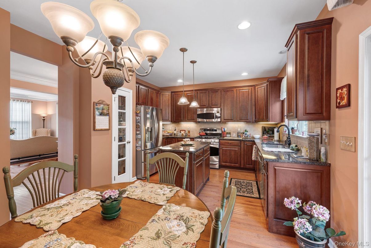 Chandelier, Dining room, Interior, Kitchen, Pendant Lights, Recessed Lighting, Stainless Steel Appliances, Wood Texture Flooring