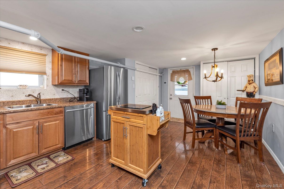 Chandelier, Dining room, Interior, Kitchen, Recessed Lighting, Stainless Steel Appliances, Wood Texture Flooring