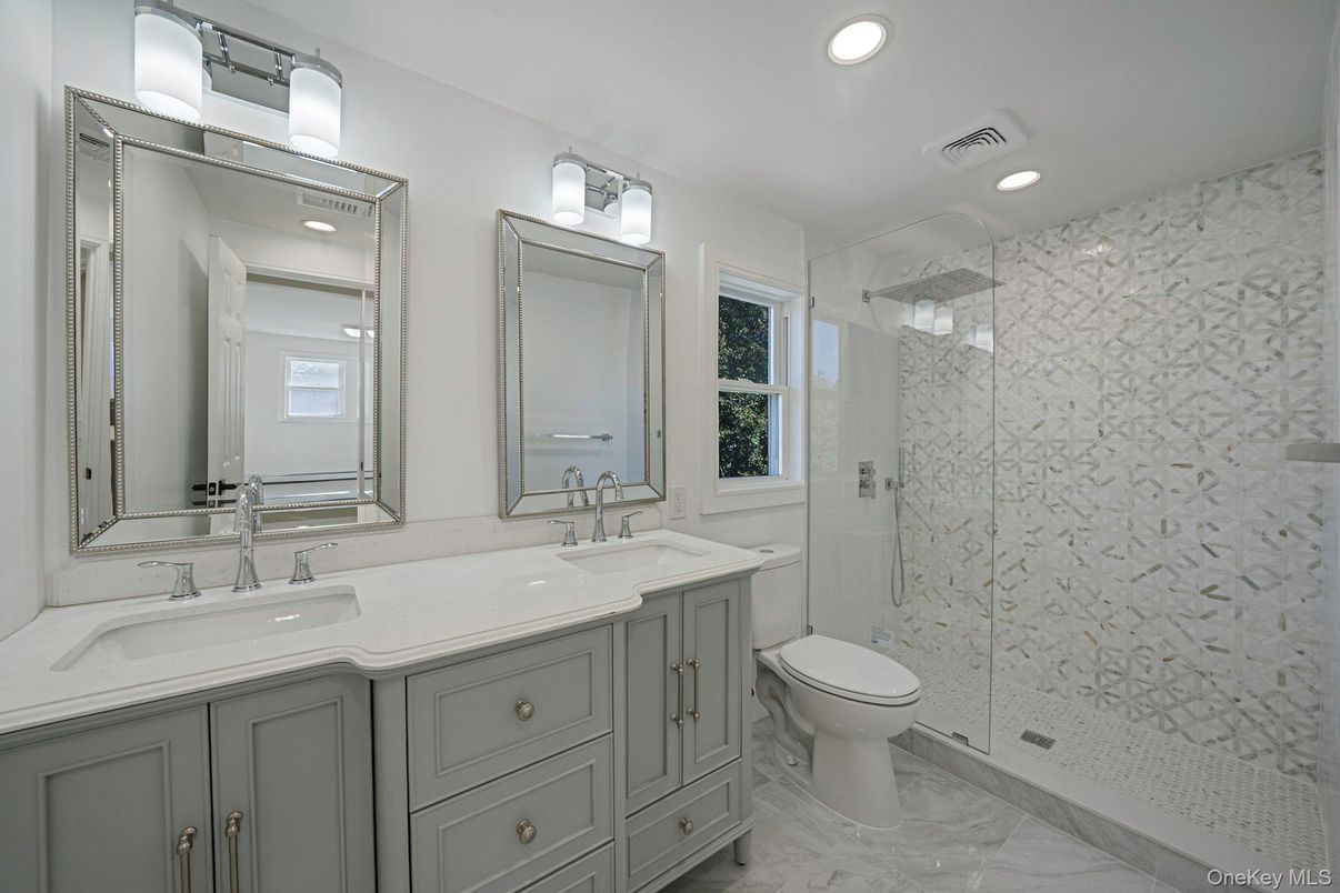 Bathroom, Dual Sink Vanities, Glass Shower, Interior, Marble, Marble Walls, Recessed Lighting