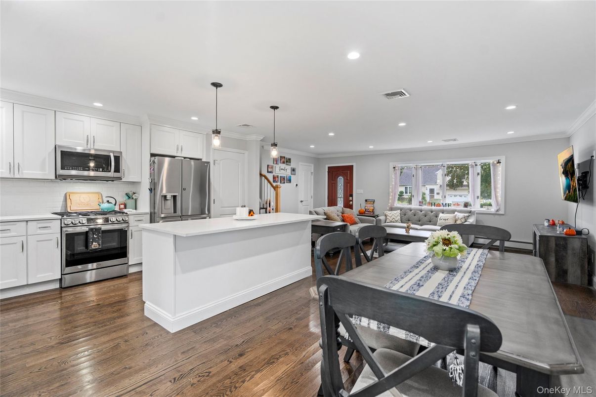 Dining room, Interior, Kitchen, Pendant Lights, Recessed Lighting, Stainless Steel Appliances, Wood Texture Flooring
