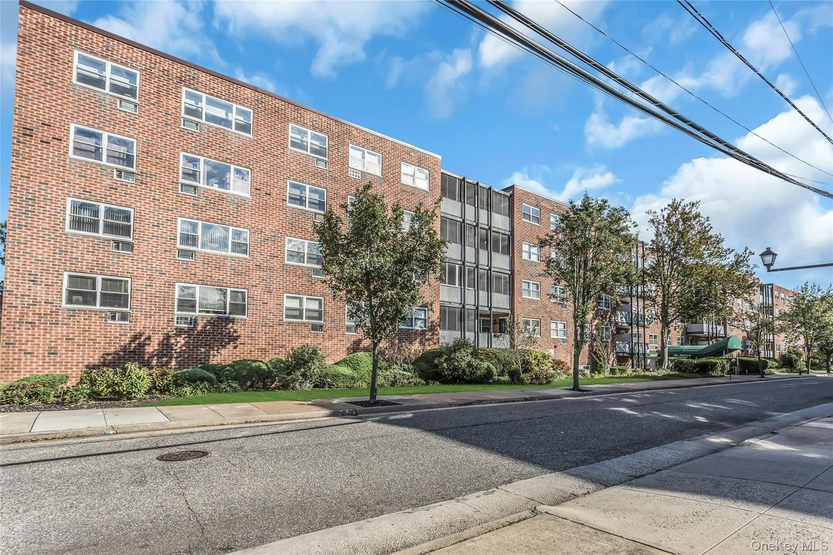 Exterior, Facade, Brick Facade, Condo Building