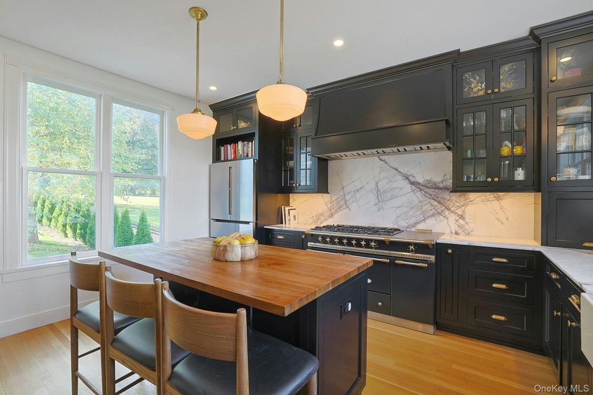 Interior, Kitchen, Marble Walls, Pendant Lights, Recessed Lighting, Stainless Steel Appliances, Wood Texture Flooring