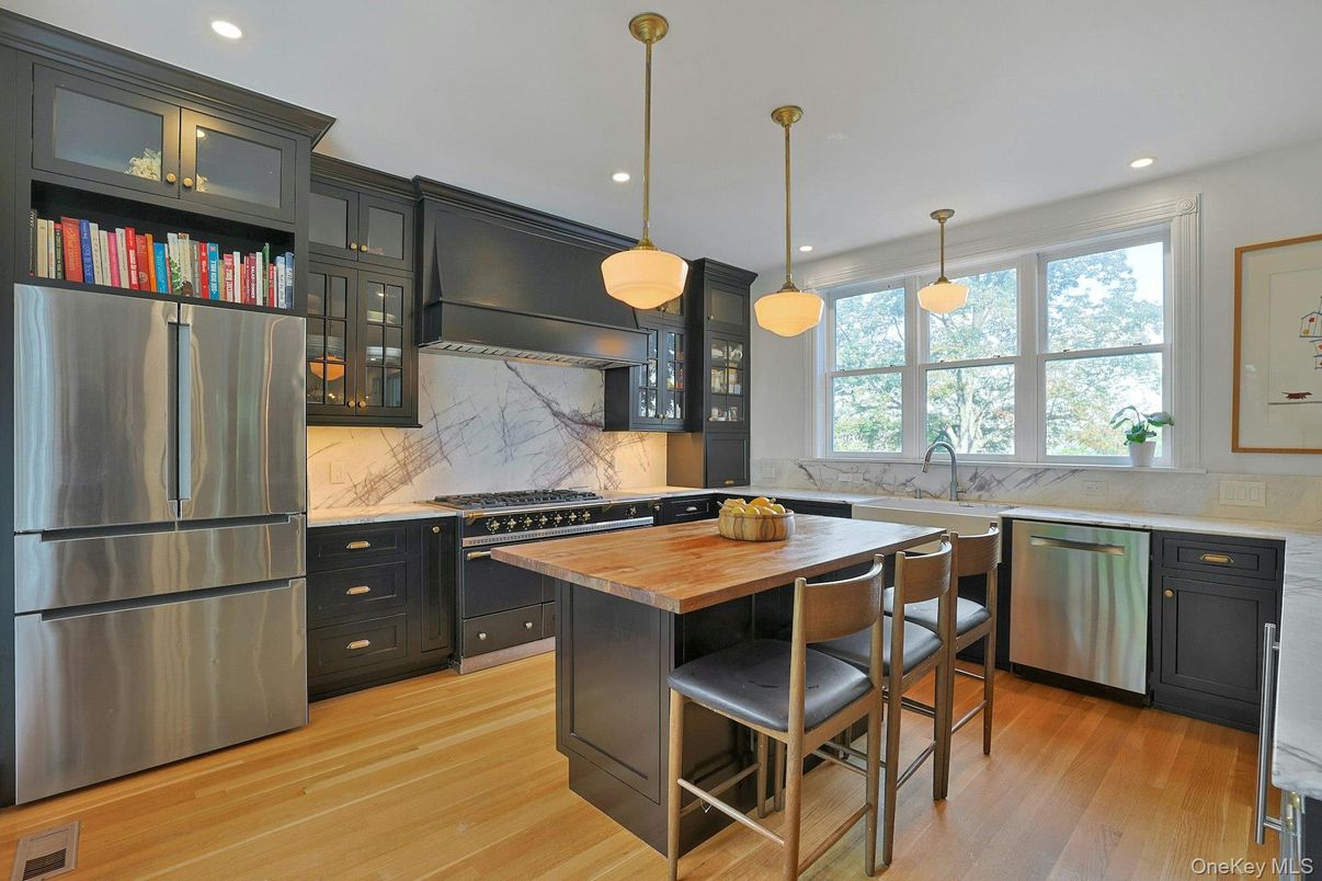 Interior, Kitchen, Marble Walls, Pendant Lights, Recessed Lighting, Stainless Steel Appliances, Wood Texture Flooring