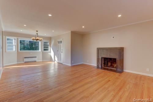 Chandelier, Empty room, Fireplace, Interior, Recessed Lighting, Wood Texture Flooring