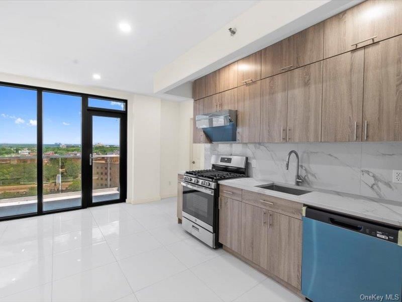 Interior, Kitchen, Marble Walls, Recessed Lighting, Stainless Steel Appliances