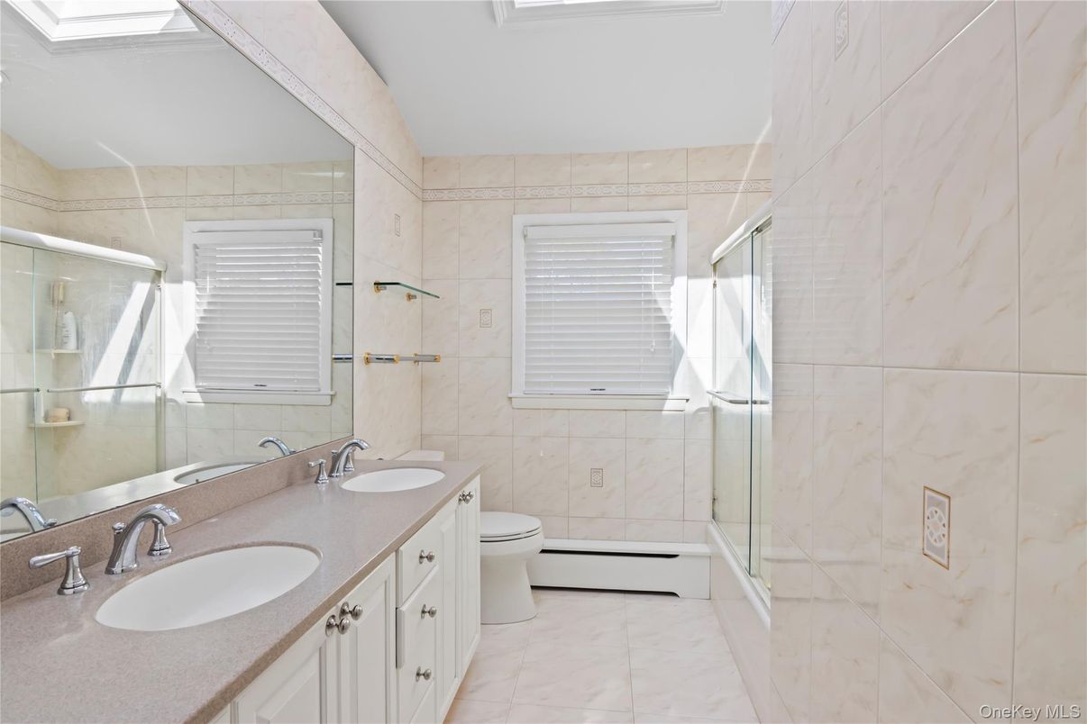 Bathroom, Dual Sink Vanities, Glass Shower, Interior, Marble, Marble Walls