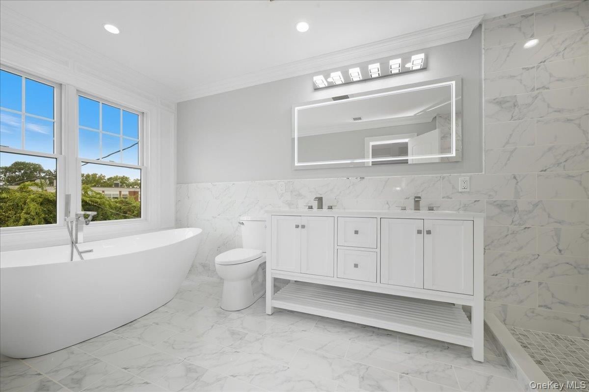 Bathroom, Dual Sink Vanities, Free Standing Baths, Interior, Marble, Marble Walls, Recessed Lighting
