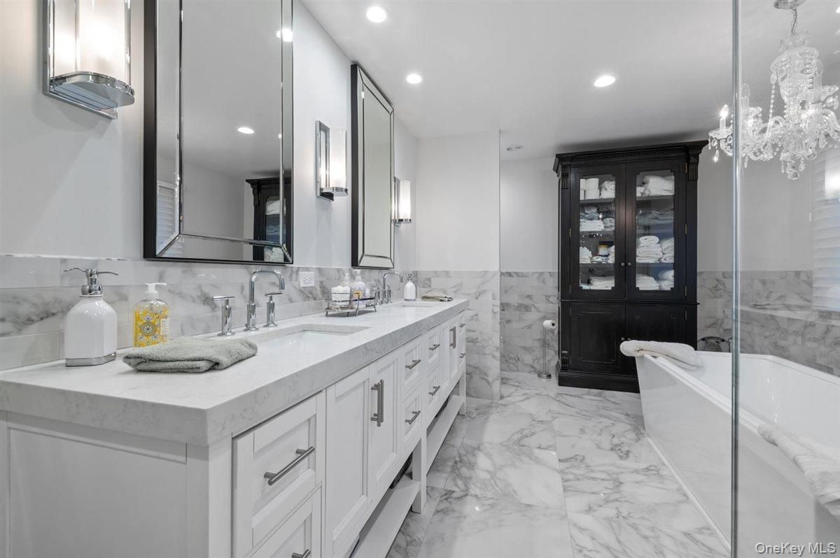 Bathroom, Chandelier, Dual Sink Vanities, Interior, Marble, Marble Walls, Recessed Lighting