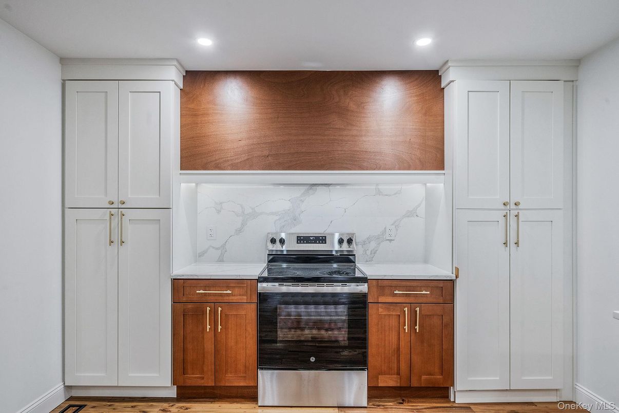 Interior, Kitchen, Marble Walls, Recessed Lighting, Stainless Steel Appliances, Wood Texture Flooring