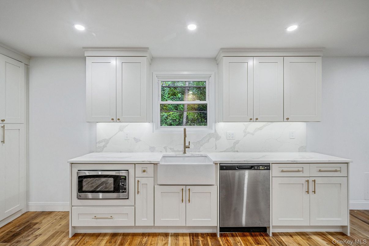 Interior, Kitchen, Marble Walls, Recessed Lighting, Stainless Steel Appliances, Wood Texture Flooring