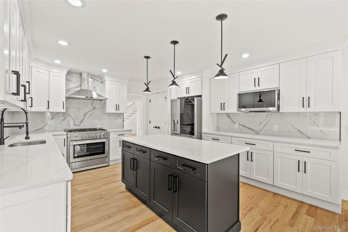 Interior, Kitchen, Marble Walls, Pendant Lights, Recessed Lighting, Stainless Steel Appliances, Wood Texture Flooring