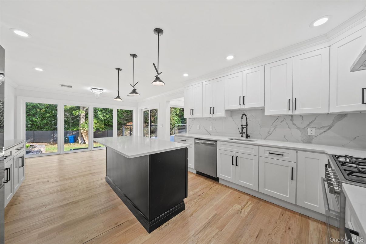 Interior, Kitchen, Marble Walls, Pendant Lights, Recessed Lighting, Stainless Steel Appliances, Wood Texture Flooring