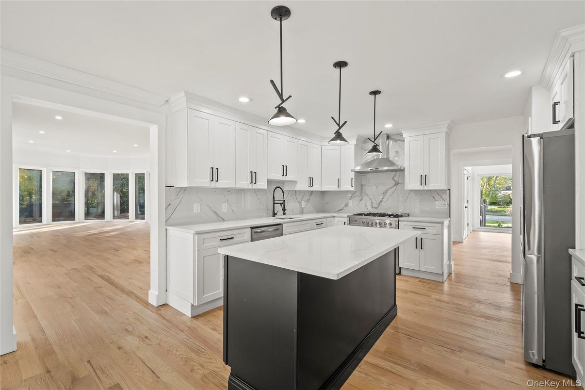 Interior, Kitchen, Marble Walls, Pendant Lights, Recessed Lighting, Stainless Steel Appliances, Wood Texture Flooring