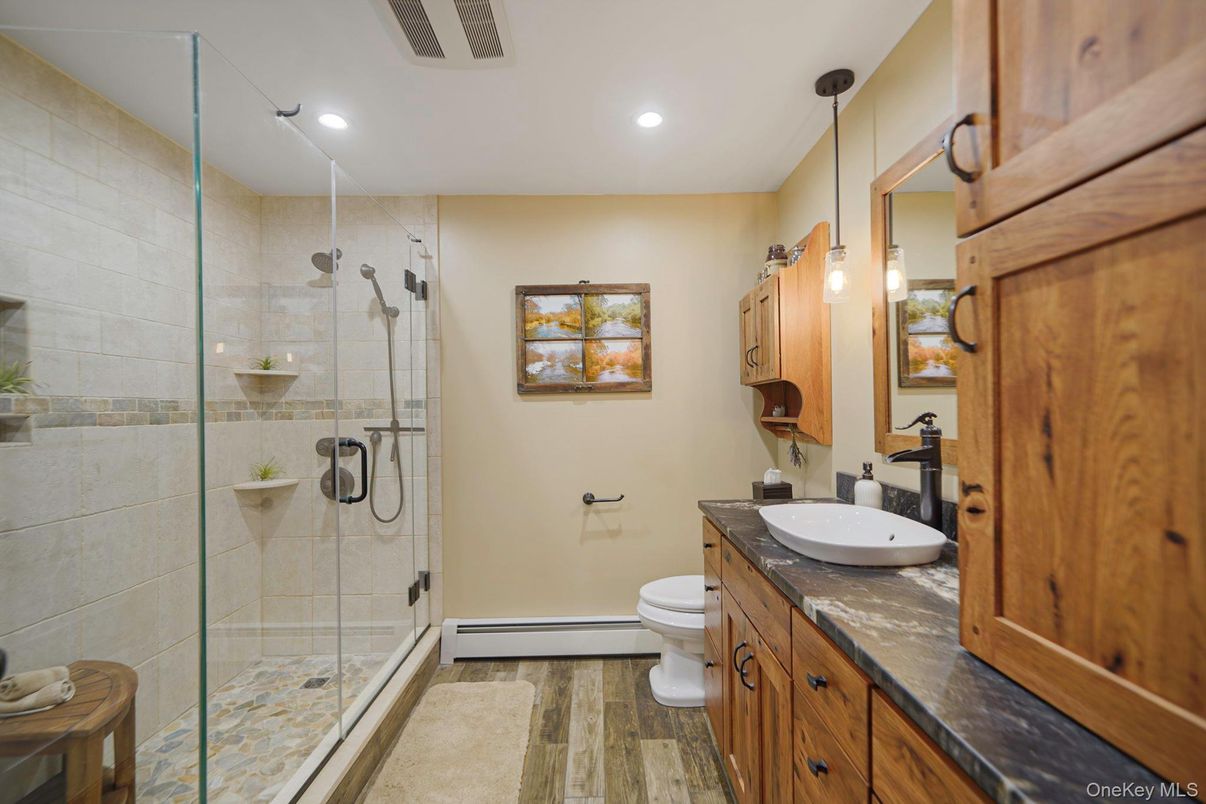 Bathroom, Glass Shower, Interior, Pendant Lights, Recessed Lighting, Wood Texture Flooring