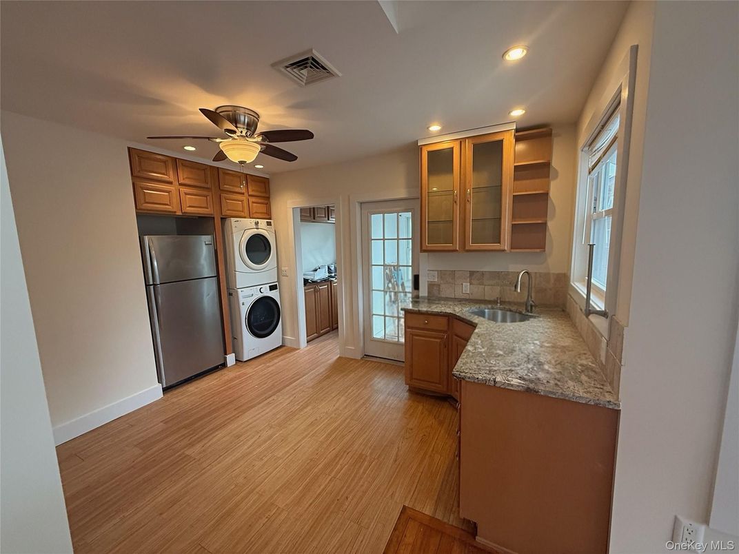 Interior, Kitchen, Recessed Lighting, Washer, Wood Texture Flooring