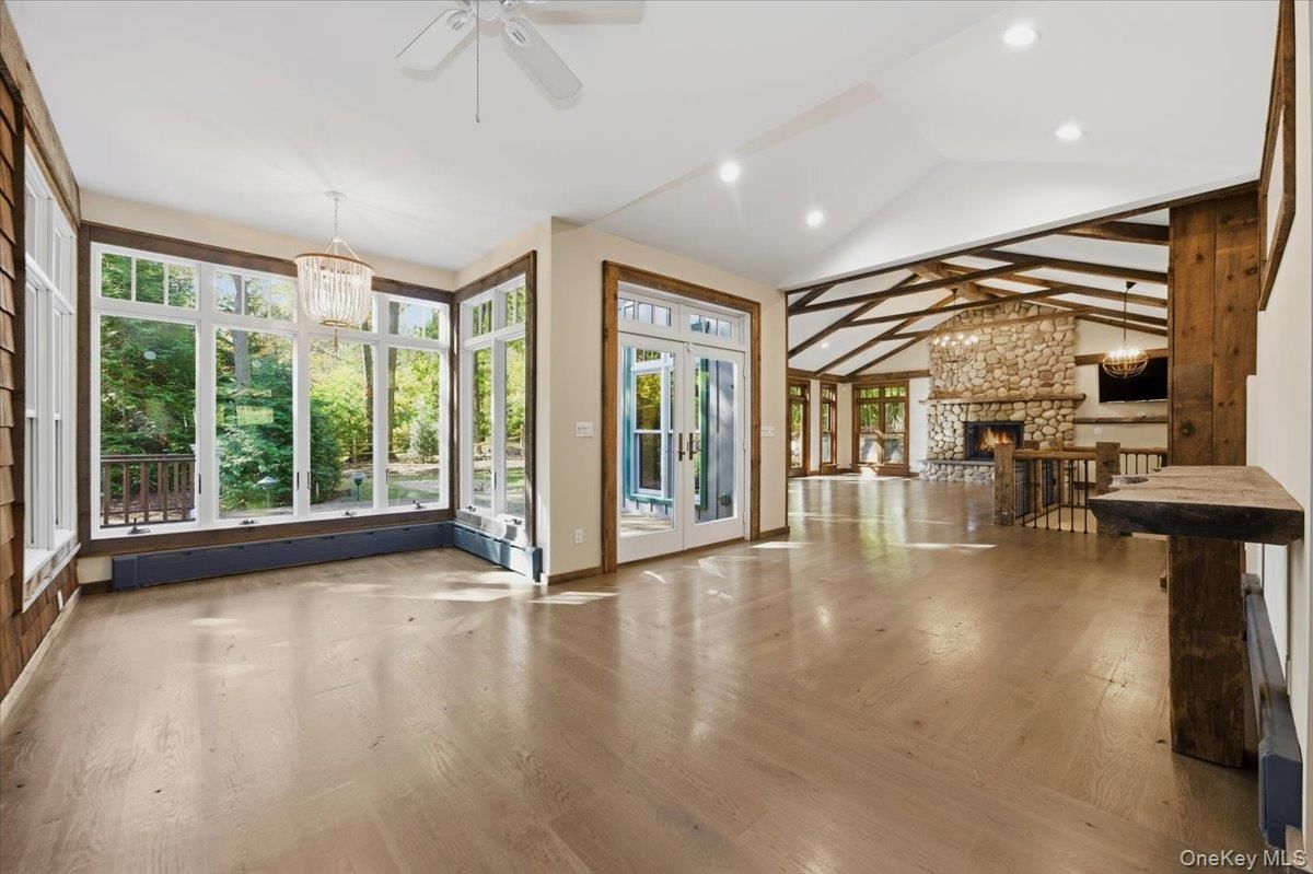 Chandelier, Dining room, Empty room, Fireplace, Interior, Pendant Lights, Recessed Lighting, Wooden Beams, Wood Texture Flooring