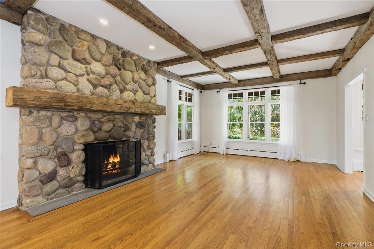 Empty room, Fireplace, Interior, Recessed Lighting, Stone Walls, Wooden Beams, Wood Texture Flooring