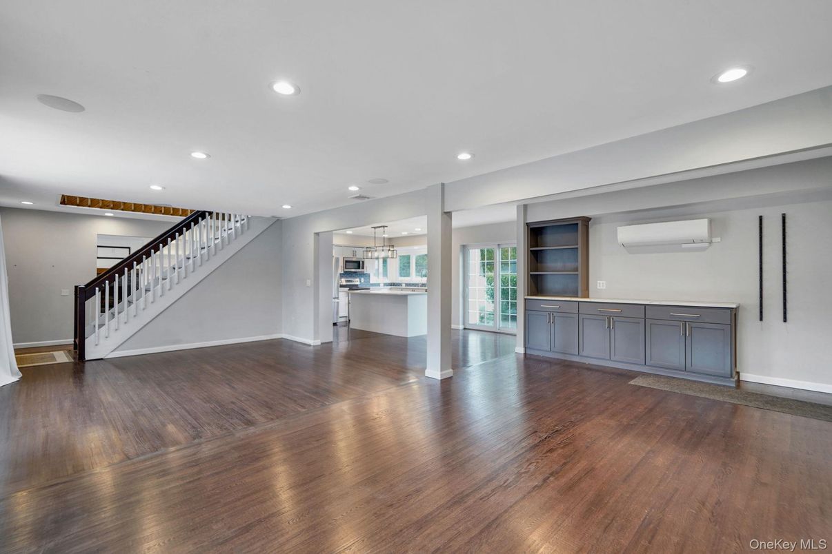 Empty room, Interior, Kitchen, Recessed Lighting, Stainless Steel Appliances, Wood Texture Flooring