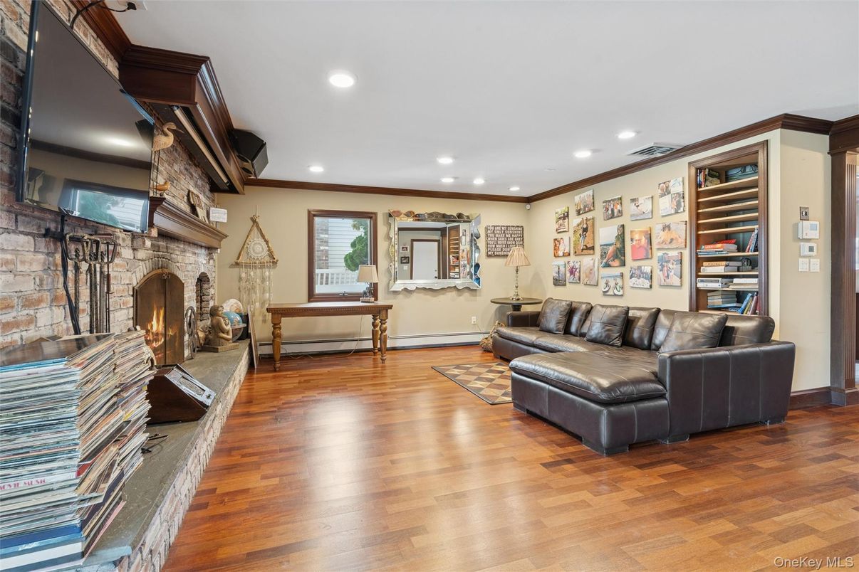 Fireplace, Interior, Living room, Recessed Lighting, Stone Walls, Wood Texture Flooring