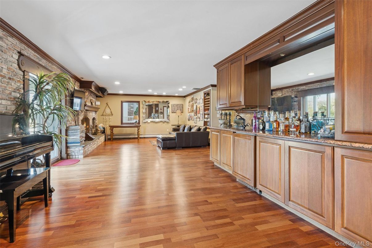 Fireplace, Interior, Piano, Recessed Lighting, Stone Walls, Wood Texture Flooring