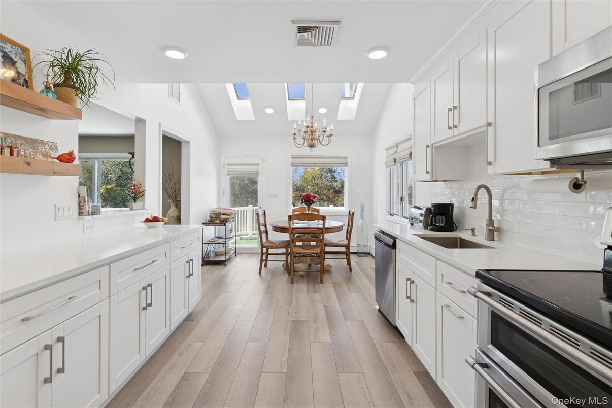 Chandelier, Dining room, Interior, Kitchen, Recessed Lighting, Stainless Steel Appliances, Wood Texture Flooring