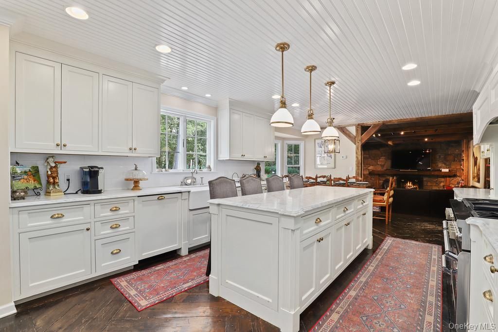 Dining room, Fireplace, Interior, Kitchen, Pendant Lights, Recessed Lighting, Stainless Steel Appliances, Wood Texture Flooring