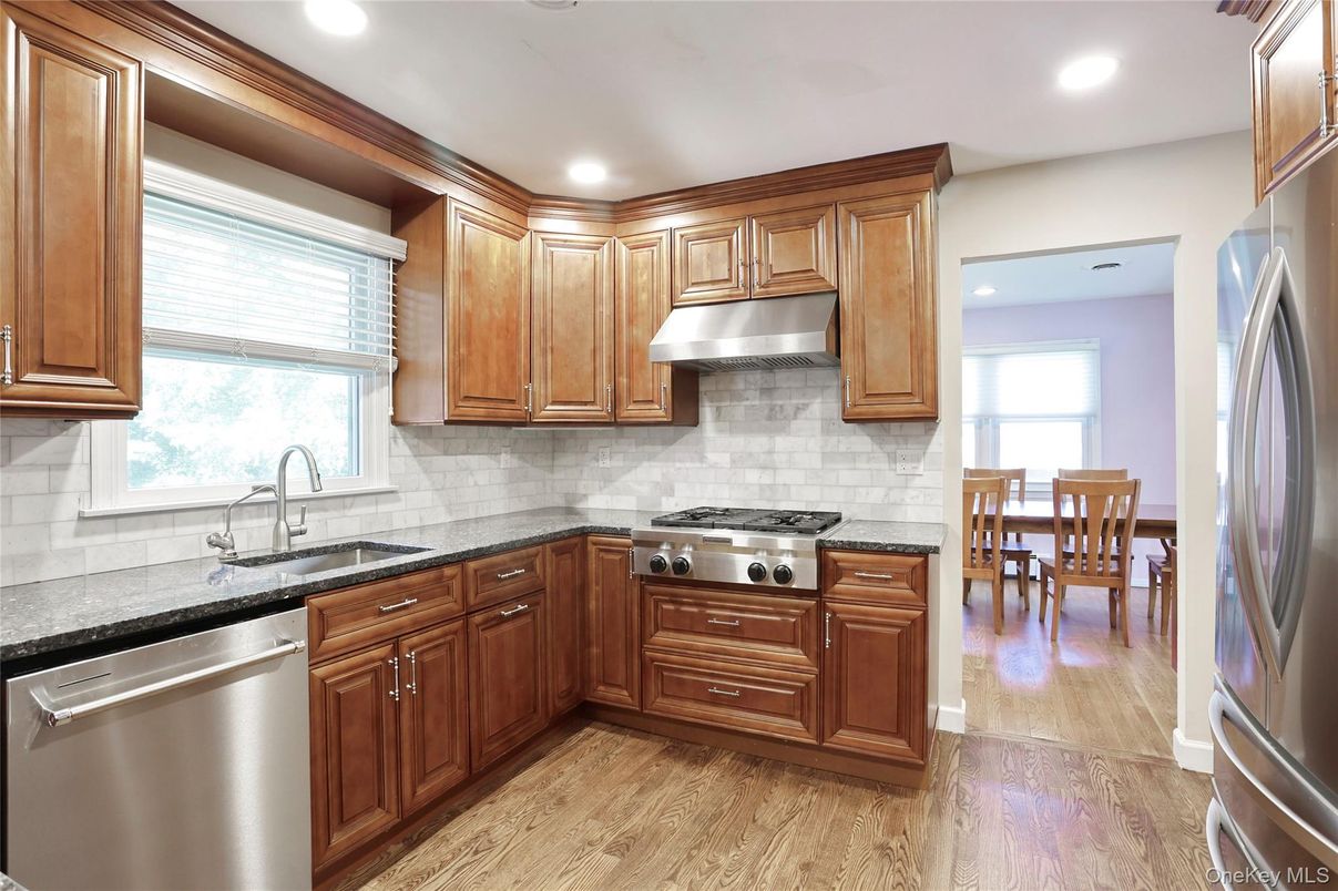 Dining room, Interior, Kitchen, Recessed Lighting, Stainless Steel Appliances, Wood Texture Flooring