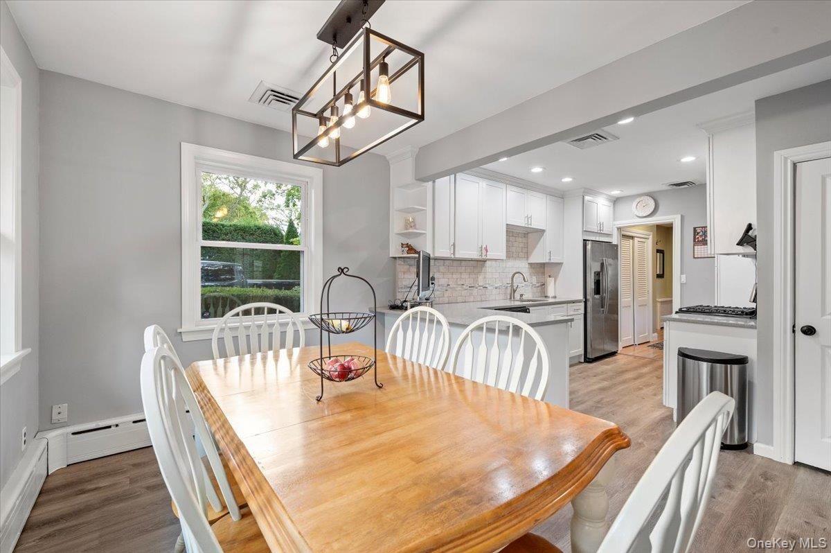 Dining room, Interior, Kitchen, Pendant Lights, Recessed Lighting, Stainless Steel Appliances, Wood Texture Flooring